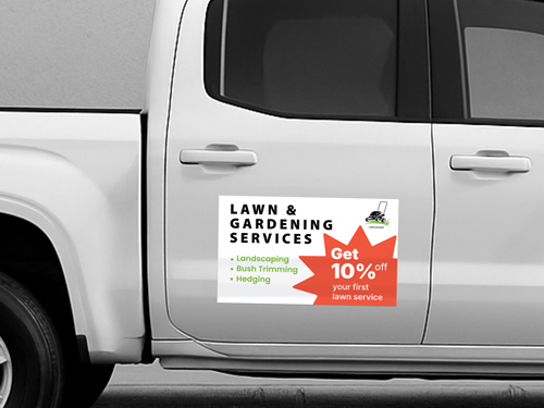 Promotional truck decal for Lawn & Gardening Services applied to the truck’s side door.