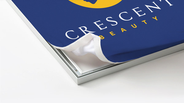 Close-up of a blue SEG fabric with corner peeling to reveal internal pages.