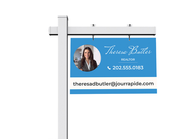 Blue realty sign post with agent's headshot, name, and contact details.