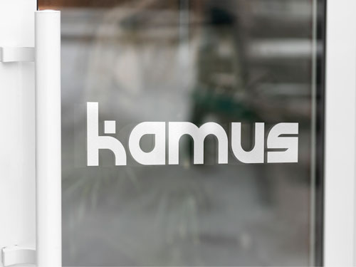 Branding vinyl lettering featuring the company's name on the glass.