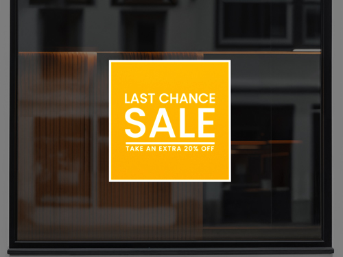 Last Chance Sale reflective decal on a window, offering an extra 20% off.