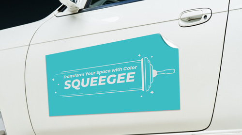 Turquoise car decal on the door showing a squeegee and the text Transform Your Space.