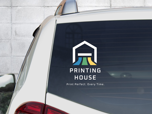 Car window decal featuring a printing house logo for mobile business promotion.