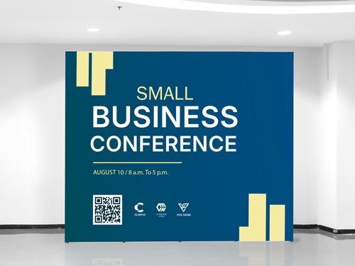 An outstanding pop up banner reading Small Business Conference.