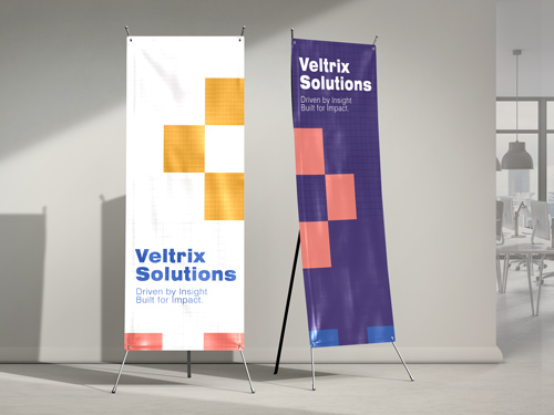 Two x-stand banners for Veltrix Solutions displaying the brand name and logo.