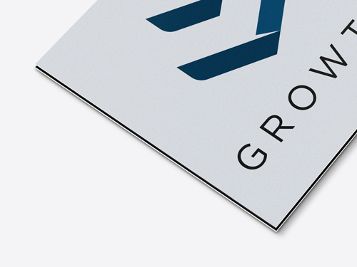 Corner view of Dibond sign displaying Growth company logo