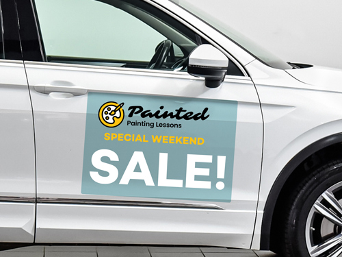 Car decal promoting painting lessons and special weekend sale event message.