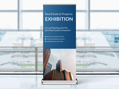 A retractable banner with a premium stand showcasing a blue panel with a photo of a building.
