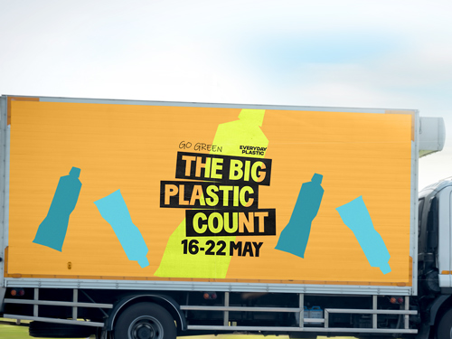 Yellow trailer decal advertising The Big Plastic Count event May 16-22.