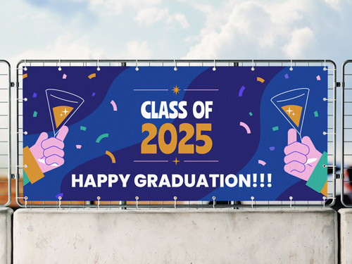 Colorful fabric banner attached to a fence, featuring hands holding graduation toasts, confetti, and a festive design celebrating the graduating class