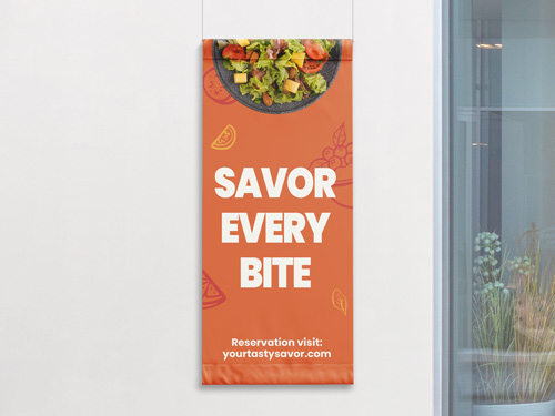 Orange fabric banner with a salad image and bold white text reading Savor Every Bite, promoting reservations