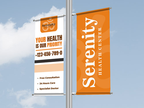 Two orange and white fabric banners for Serenity Health Center with contact info and health services like free consultation and 24-hour care