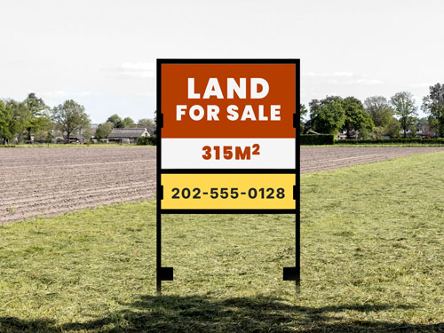 Orange land for sale H-frame sign showing 315M² with phone number placed in field.