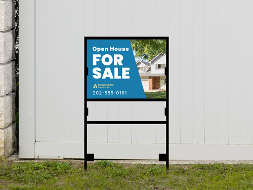 Blue and white for sale H-frame sign with house photo on black metal frame