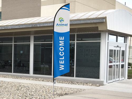 Blue and white feather flag reading Welcome for Animal Hospital.
