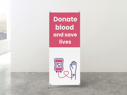 Dynamic Donate Blood, Save Lives X-stand featuring imagery of blood donation in action.