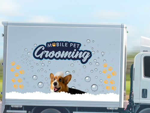 Mobile Pet Grooming trailer decal featuring a dog image.