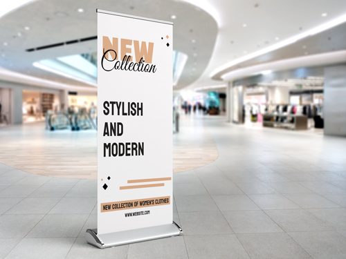 A white premium retractable banner placed in a mall environment promoting a new collection of products.