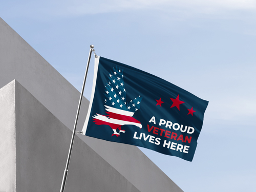 A memorial pole flag featuring an eagle and the text A Proud Veteran Lives Here.