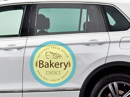 Opaque car window decal featuring a bakery advertisement with logo and branding.