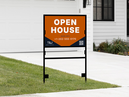 Orange and white H-frame sign with phone number on black metal frame in front yard.