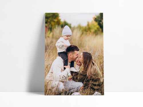 Personalized foam board sign featuring a warm outdoor family portrait with natural lighting and a soft, autumnal background