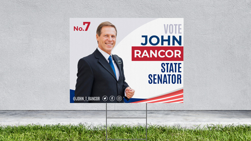 Vibrant plastic political campaign sign displayed outdoors