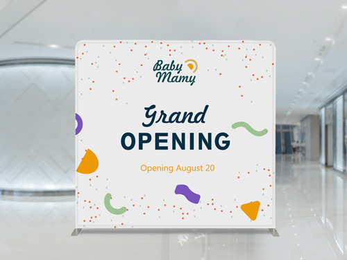 A tension fabric backdrop showcasing a grand opening of a branded store in a mall environment.