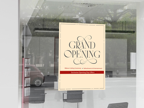 Festive window decal reading Grand Opening with red floral accents