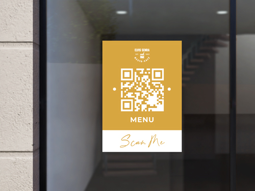 Yellow static cling on store window featuring a QR code for scanning the menu.