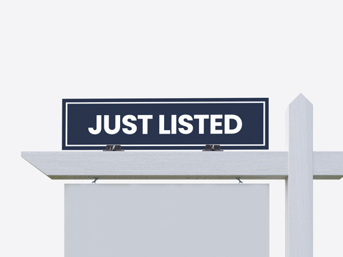 Just Listed real estate sign rider in navy with white text