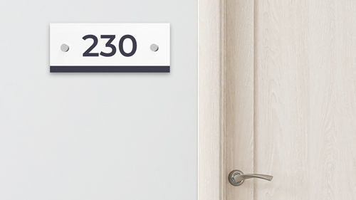 Room Numbers & Restroom plastic sign, wall-mounted, displaying the number 230.