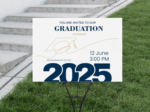 Graduation yard sign on a lawn featuring bold blue and yellow colors with celebratory graphics like a graduation cap, designed to honor a graduating student