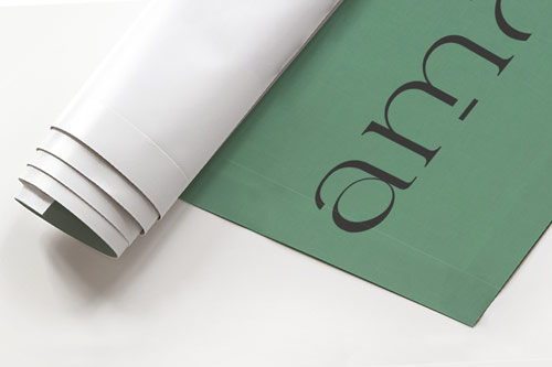 Close-up image of a rolled green snap hanging poster.