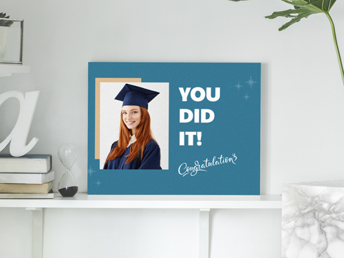 Wooden sign for special occasion showing a graduating girl with the text You Did It.