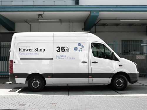 Vinyl lettering on white van displaying Flower Shop branding with 35% offer.