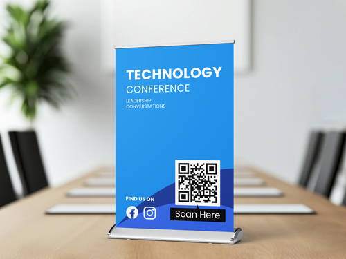 Blue tabletop retractable banner with QR code and conference name displayed.