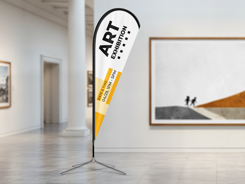 White and yellow teardrop banner flag with art gallery text in modern interior space.