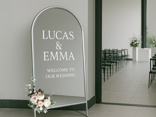 Wedding welcome message in vinyl lettering applied to a mirror for the ceremony.