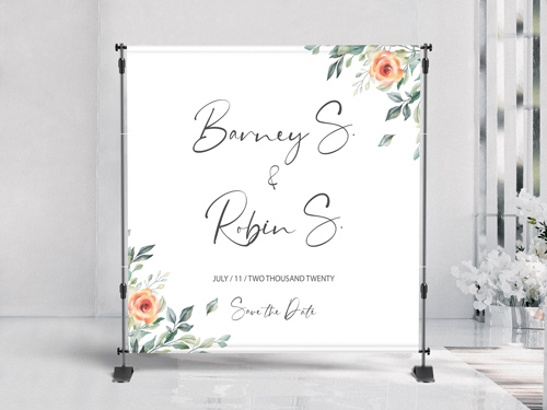 Wedding-themed step and repeat banner with decorative elements.