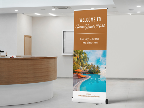 A retractable banner placed in a hotel lobby to welcome guests.